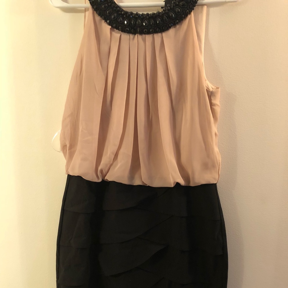 Cream knee length dress with beaded detailing
